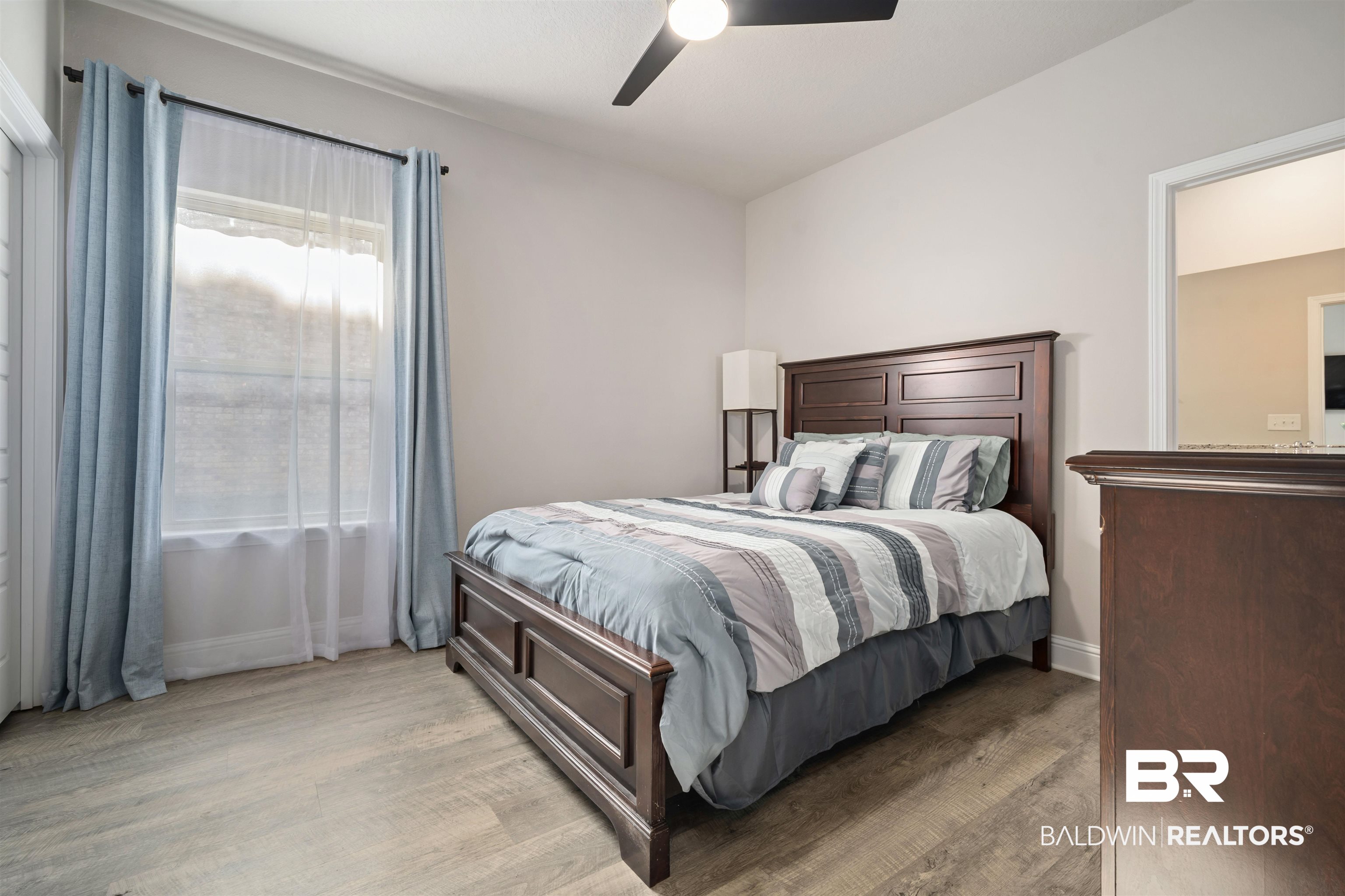 1700 Gwin Court Mobile, AL 36695 - Photo 27 of 36 Bedroom featuring light wood-style floors and a ceiling fan