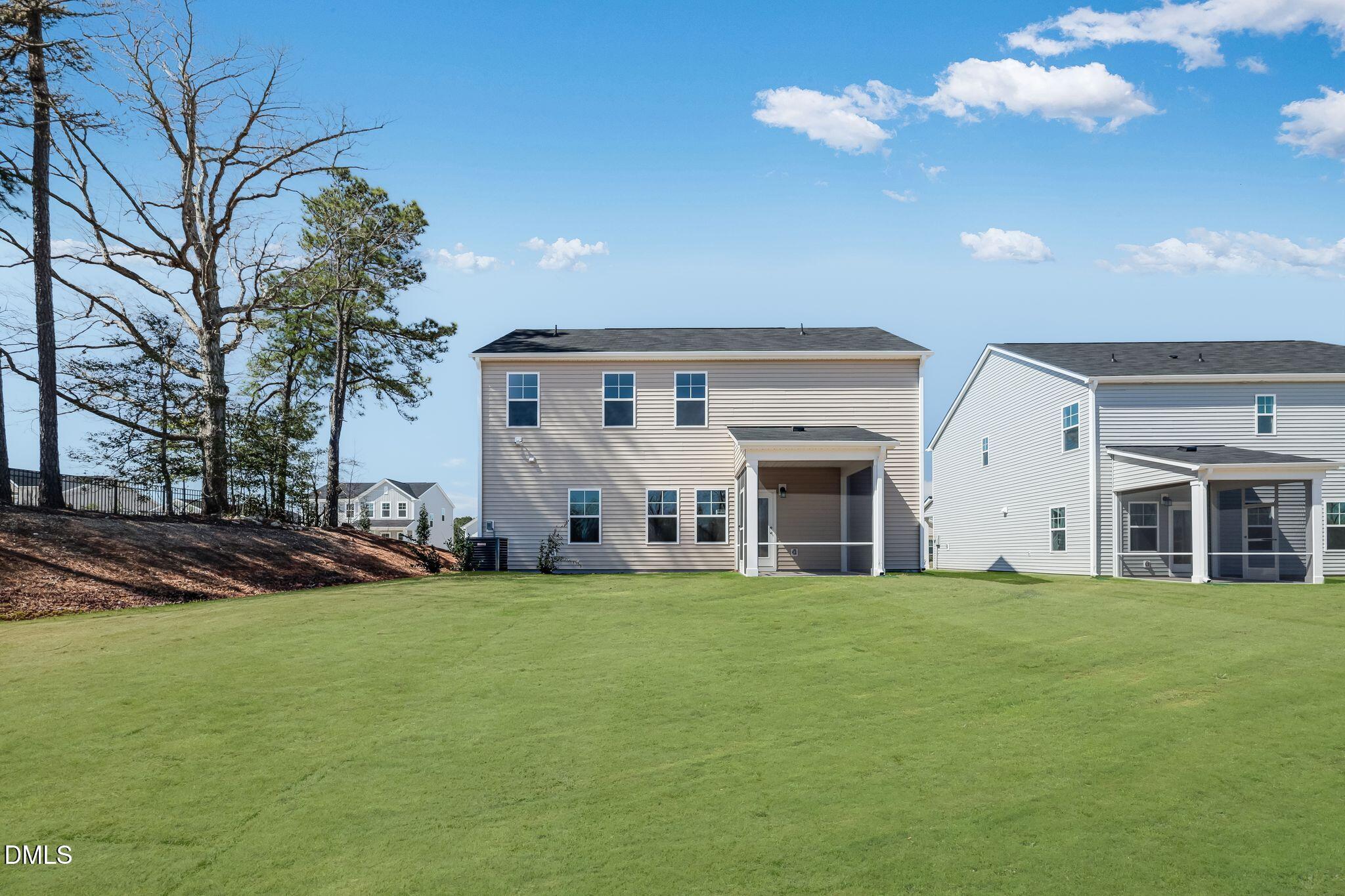 5818 Millstone Way Sims, NC 27880 - Photo 24 of 24 a large building with a big yard and large trees