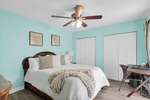 a bedroom with a bed and a table