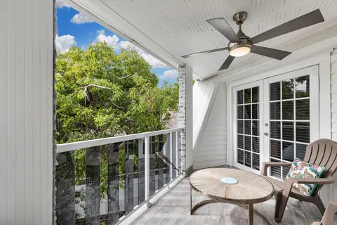 a view of a porch with furniture and a window