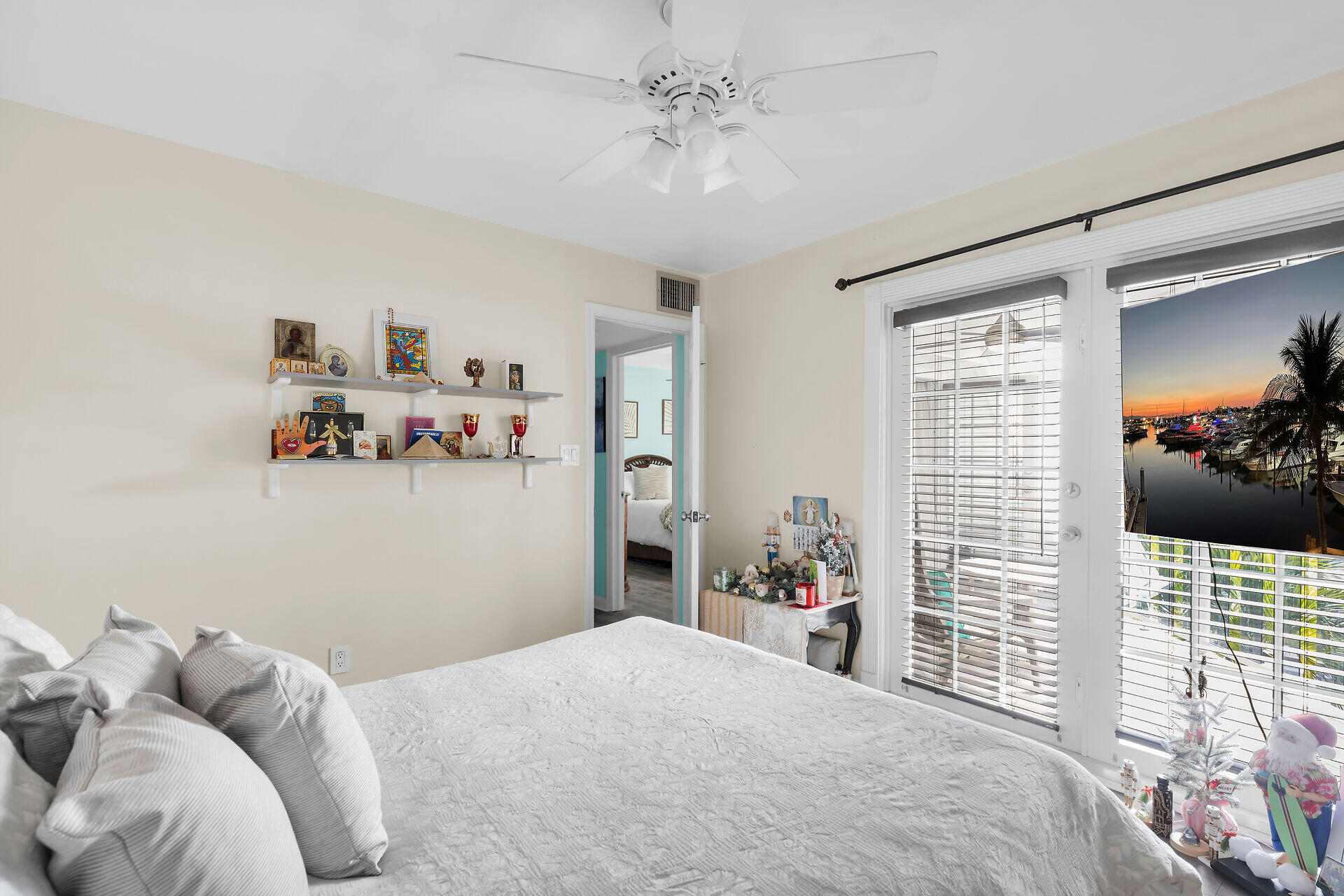 3205 Pearl Avenue Key West, FL 33040 - Photo 22 of 32 a bedroom with a bed and a chandelier