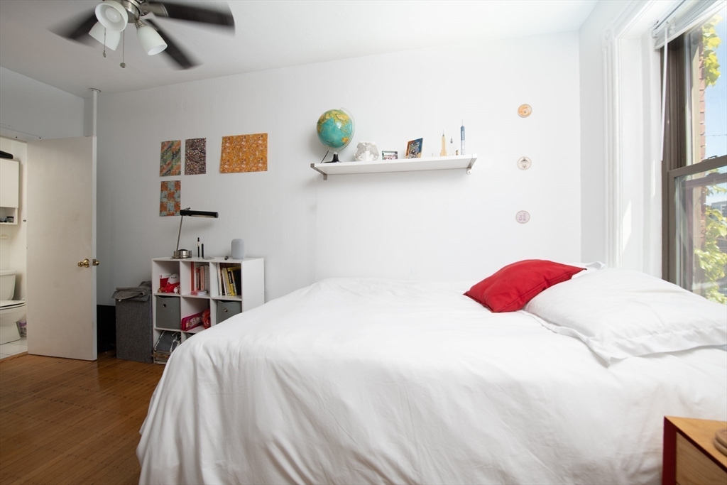 918 Beacon Street, Unit 3 Boston, MA 02215 - Photo 12 of 19 a bedroom with a bed and painting on the wall