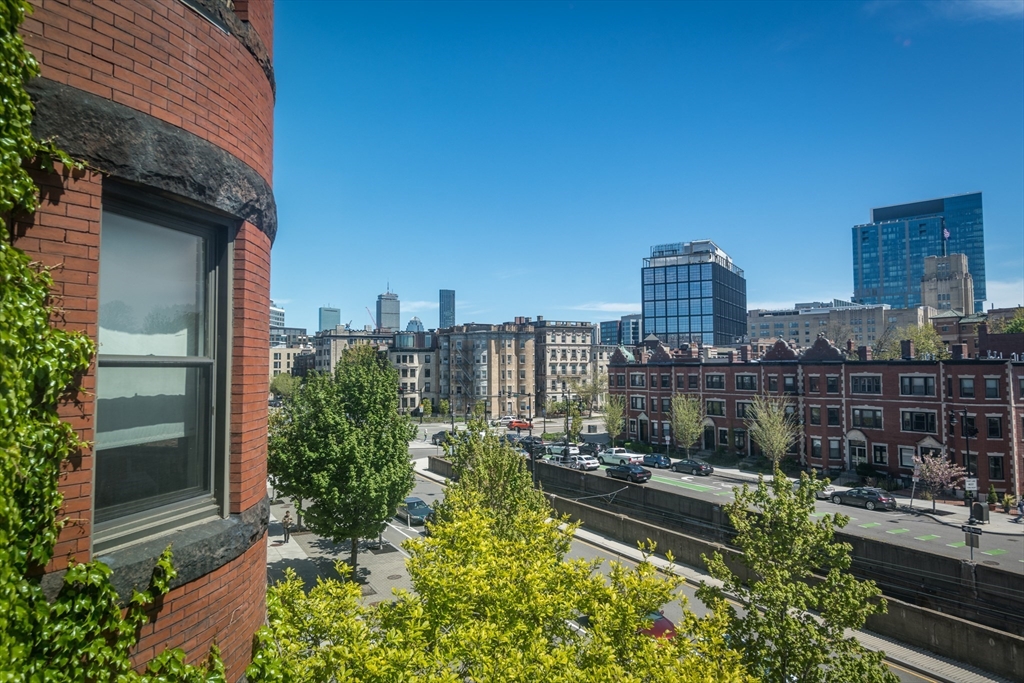 918 Beacon Street, Unit 3 Boston, MA 02215 - Photo 15 of 19 a view of a lake with tall building in front of it