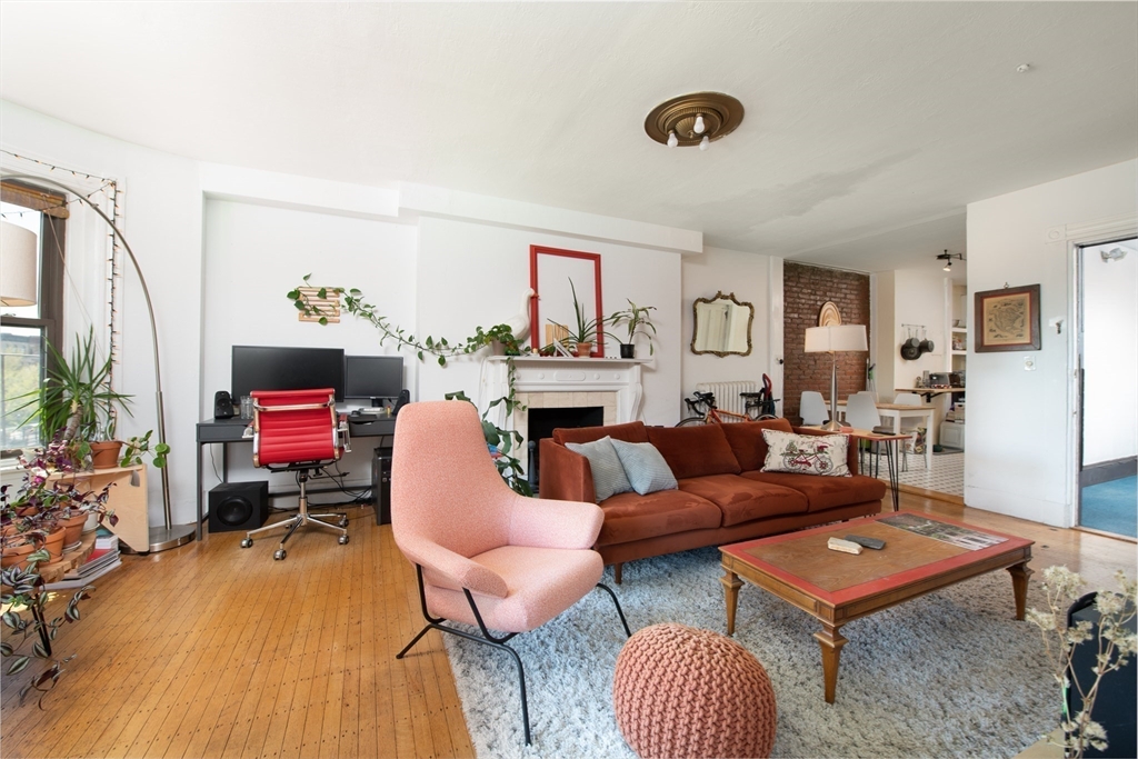 918 Beacon Street, Unit 3 Boston, MA 02215 - Photo 3 of 19 a living room with furniture and a fireplace