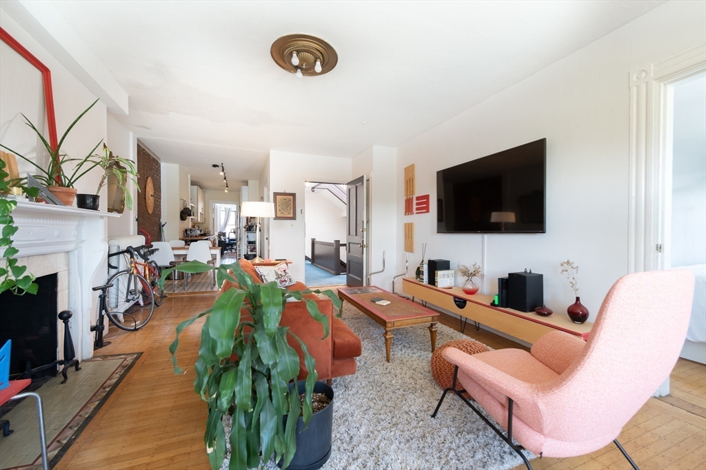 918 Beacon Street, Unit 3 Boston, MA 02215 - Photo 4 of 19 a living room with furniture and a flat screen tv