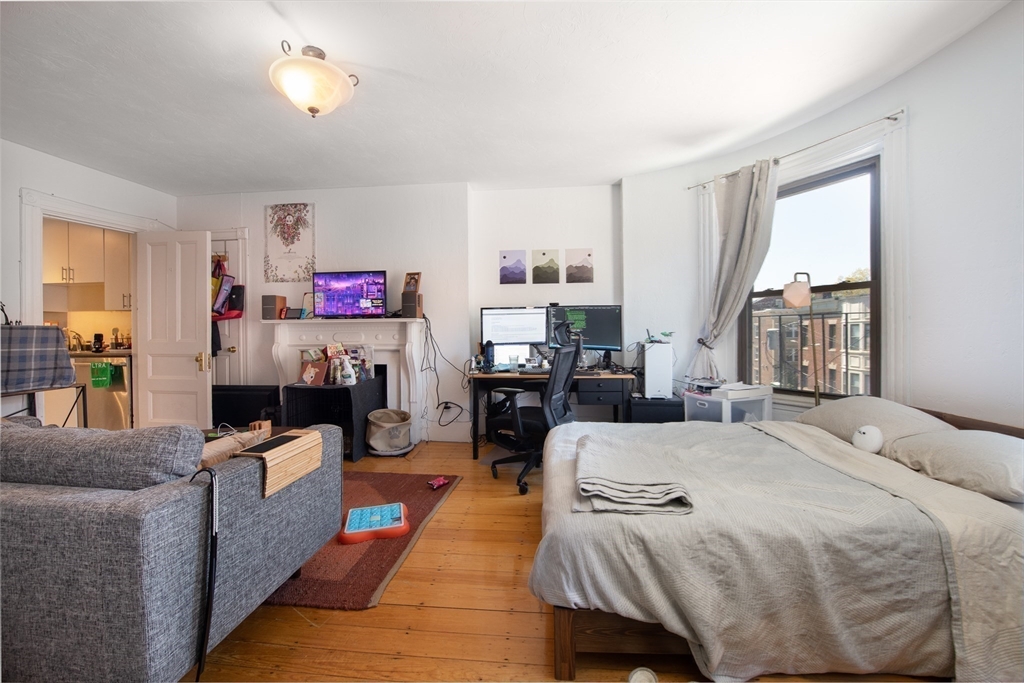 918 Beacon Street, Unit 3 Boston, MA 02215 - Photo 8 of 19 a bed room with a bed furniture and a window