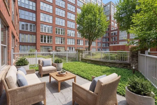 a view of a patio in the backyard