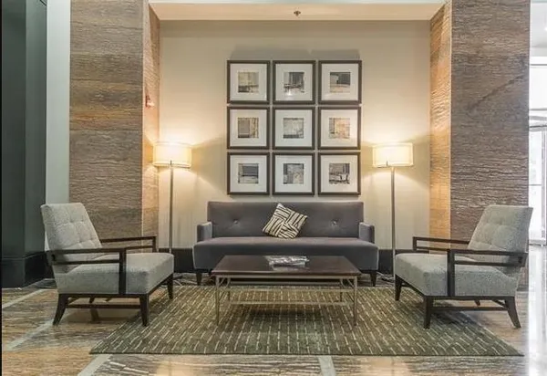 a living room with furniture and a rug