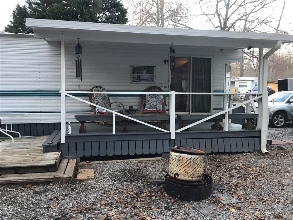 a view of a house with a wooden deck