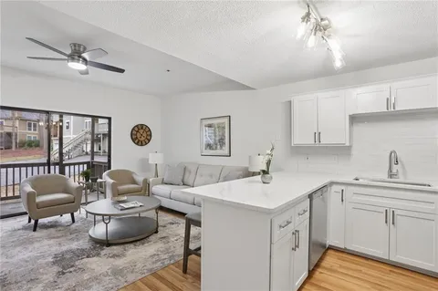 a kitchen with a sink cabinets and appliances
