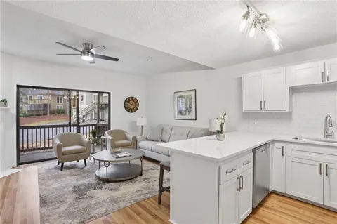 a kitchen with a sink cabinets and window