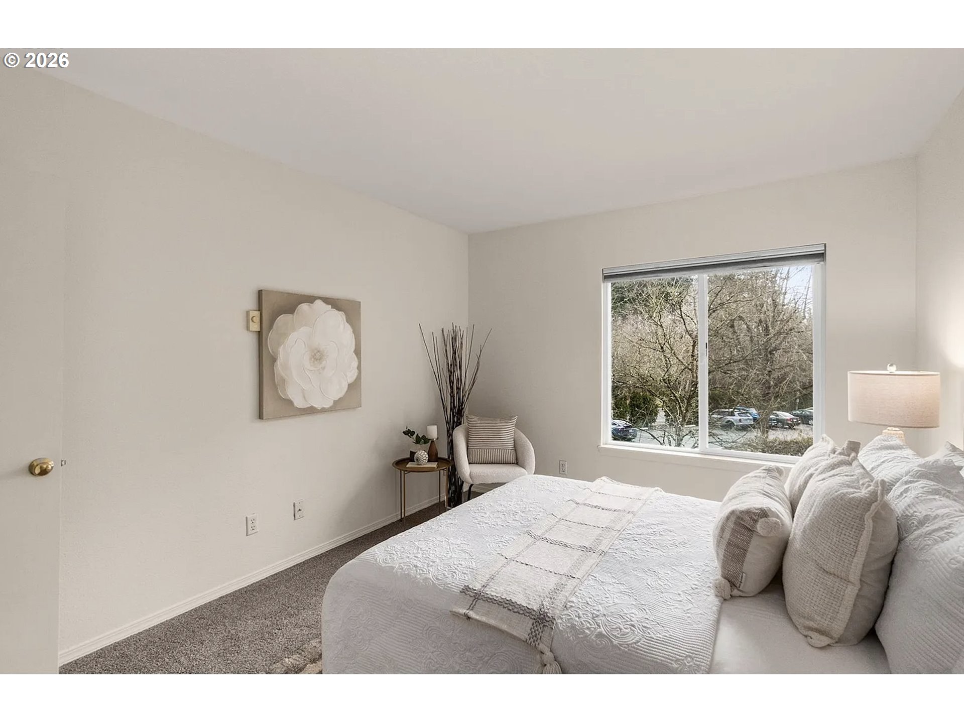 8720 Southwest Tualatin Road, Unit 205 Tualatin, OR 97062 - Photo 14 of 23 a bedroom with a bed and a large window