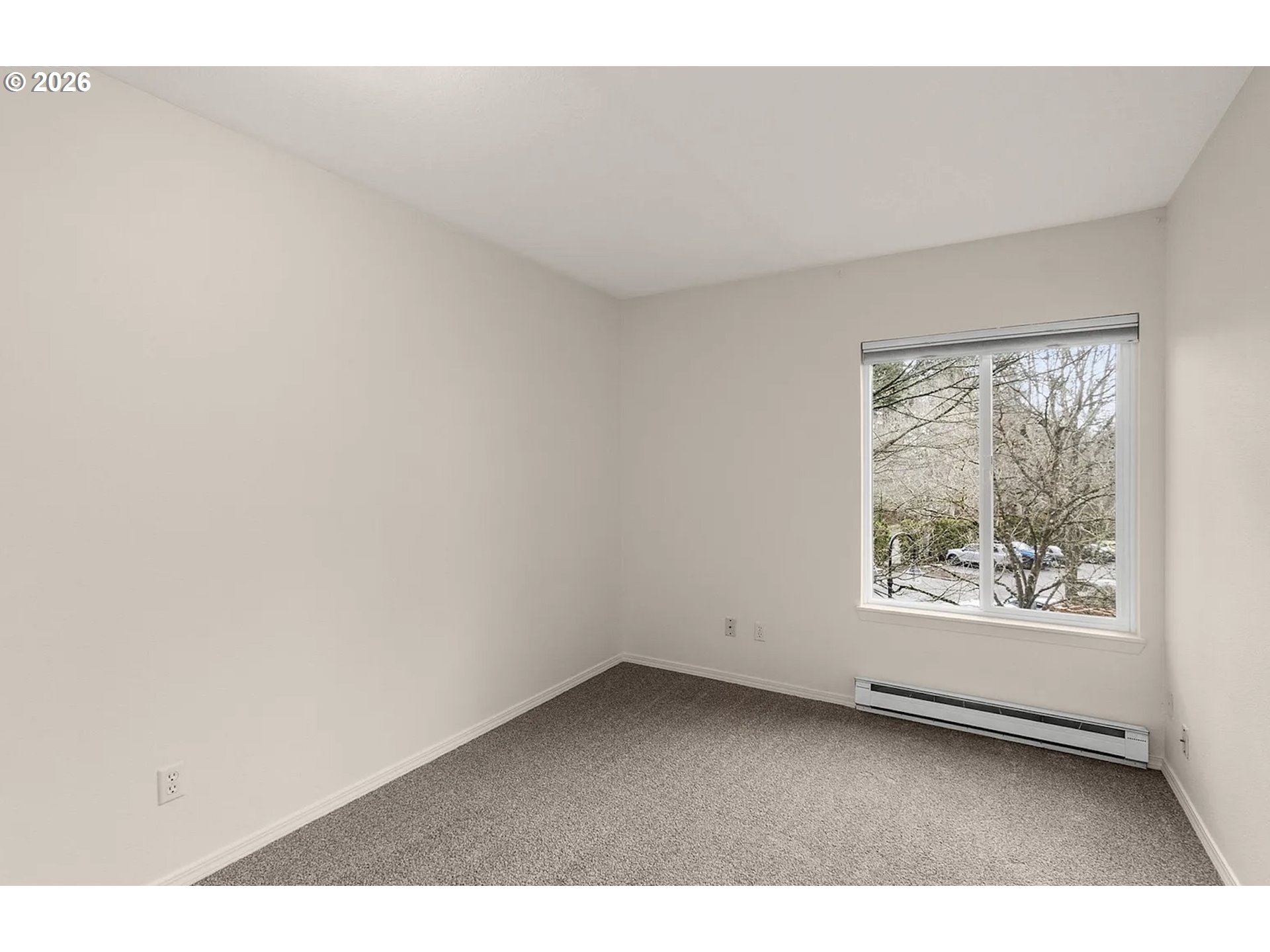 8720 Southwest Tualatin Road, Unit 205 Tualatin, OR 97062 - Photo 18 of 23 a view of an empty room with a window