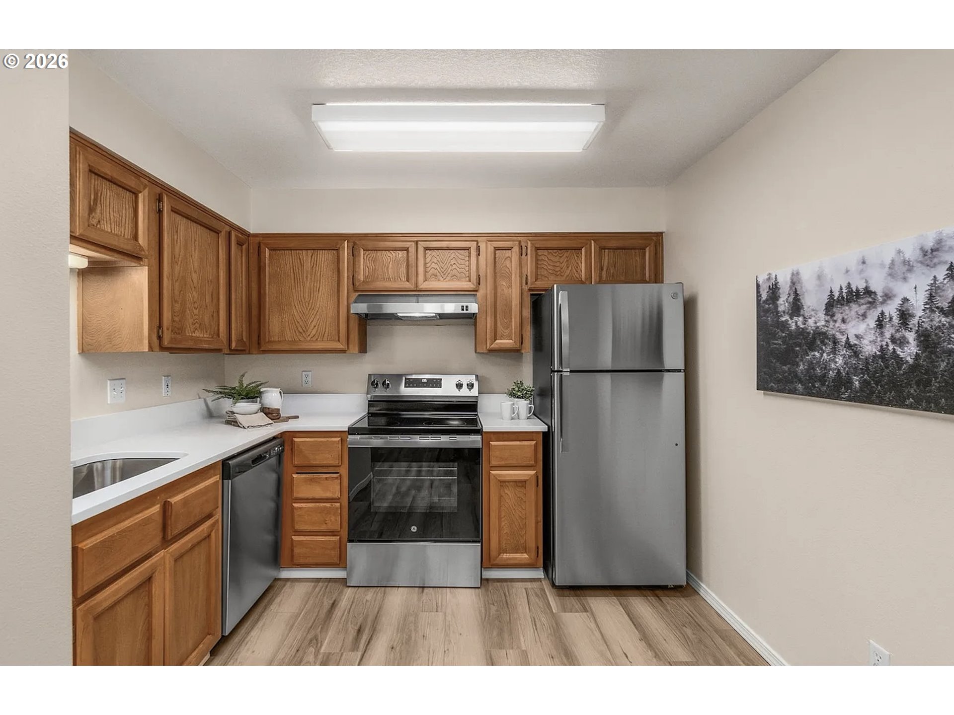 8720 Southwest Tualatin Road, Unit 205 Tualatin, OR 97062 - Photo 5 of 23 a kitchen with a refrigerator sink and stove