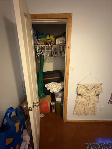 a bathroom with a sink a toilet a mirror and window