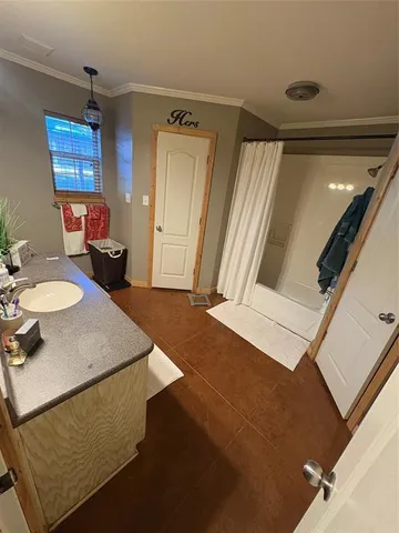 a bathroom with a sink vanity and a mirror