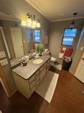 a bedroom with bed and window