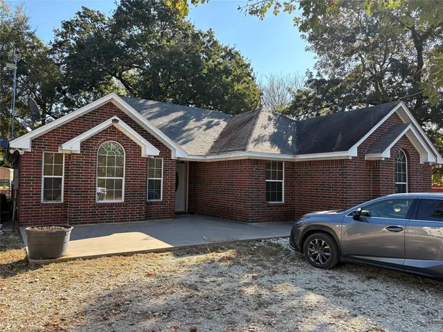 a car parked in front of a house