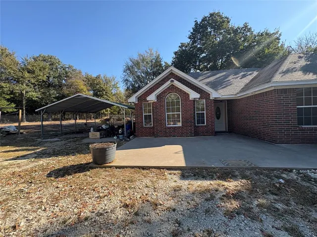 a view of backyard with green space