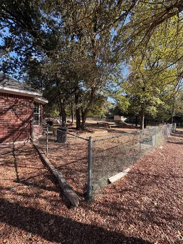 a backyard of a house with lots of green space
