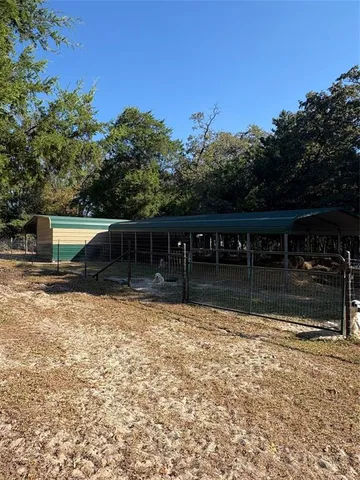 a backyard of a house with lots of green space and mountain view