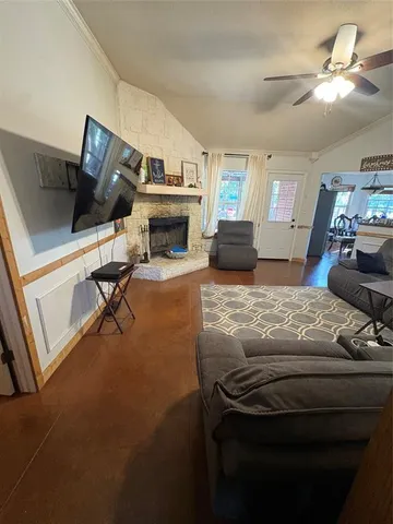 a living room with furniture and a fireplace