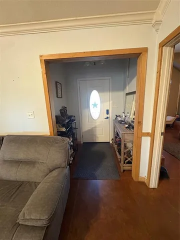 a living room with furniture and a mirror