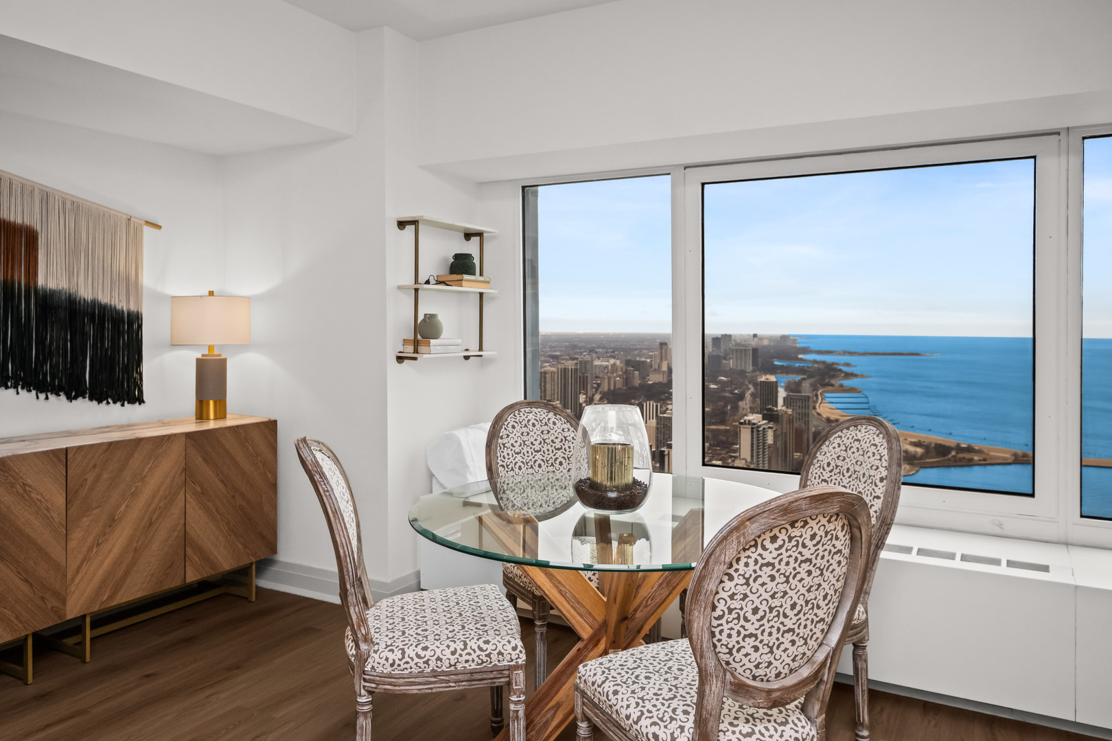 175 East Delaware Place, Unit 5808 Chicago, IL 60611 - Photo 12 of 29 a dining room with furniture water view and wooden floor