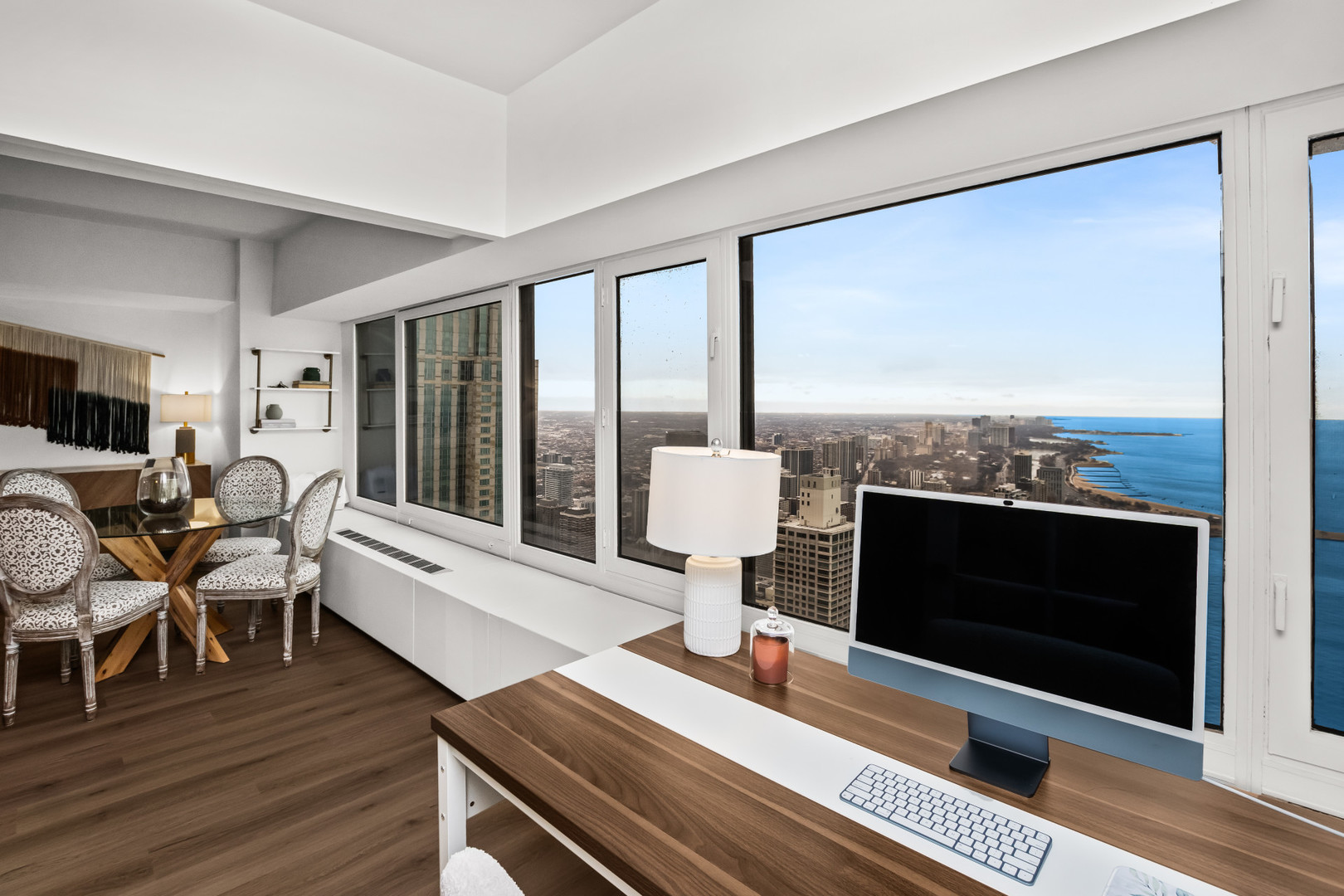 175 East Delaware Place, Unit 5808 Chicago, IL 60611 - Photo 13 of 29 a living room with furniture wooden floor a fireplace and a floor to ceiling window