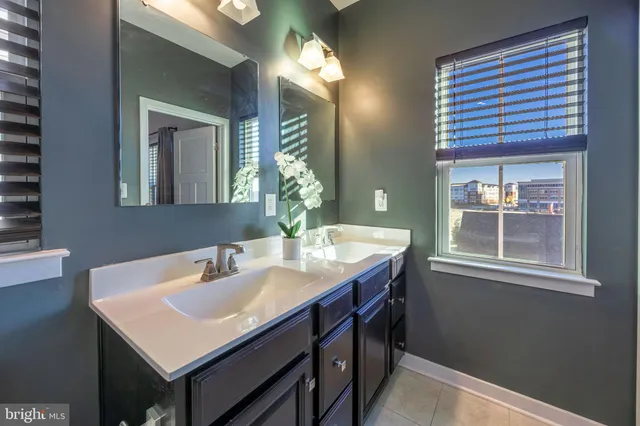 a view of a room with wooden floor and a large window