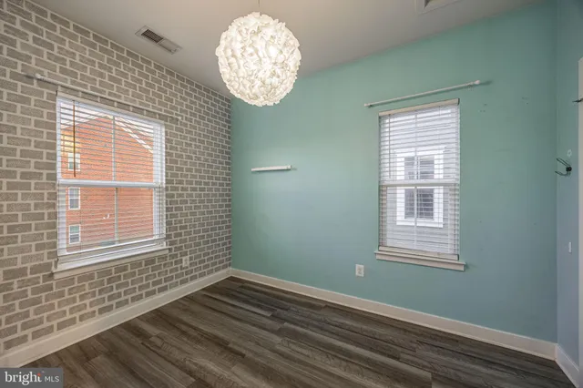 a view of small space with wooden floor