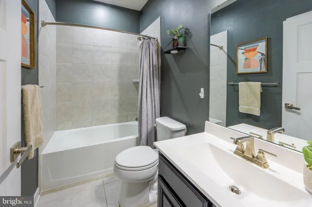 a bedroom with a bed and a table