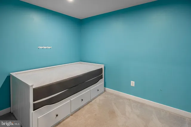 a living room with a furniture and a window