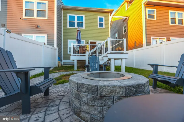 a view of a house with backyard porch and sitting area