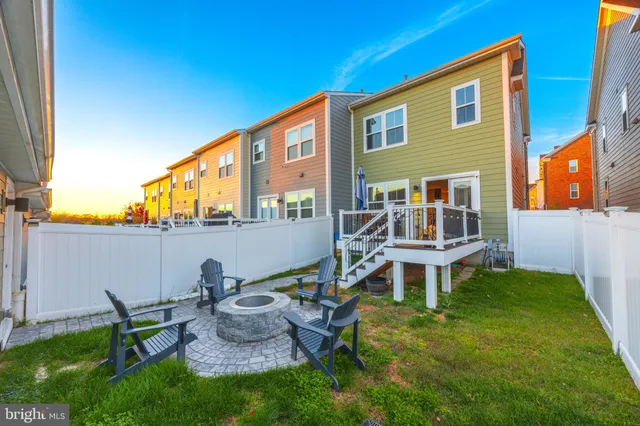 a house view with a sitting space and garden