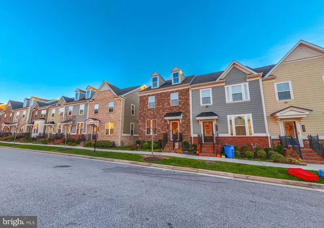 a view of a city with tall buildings and a big yard