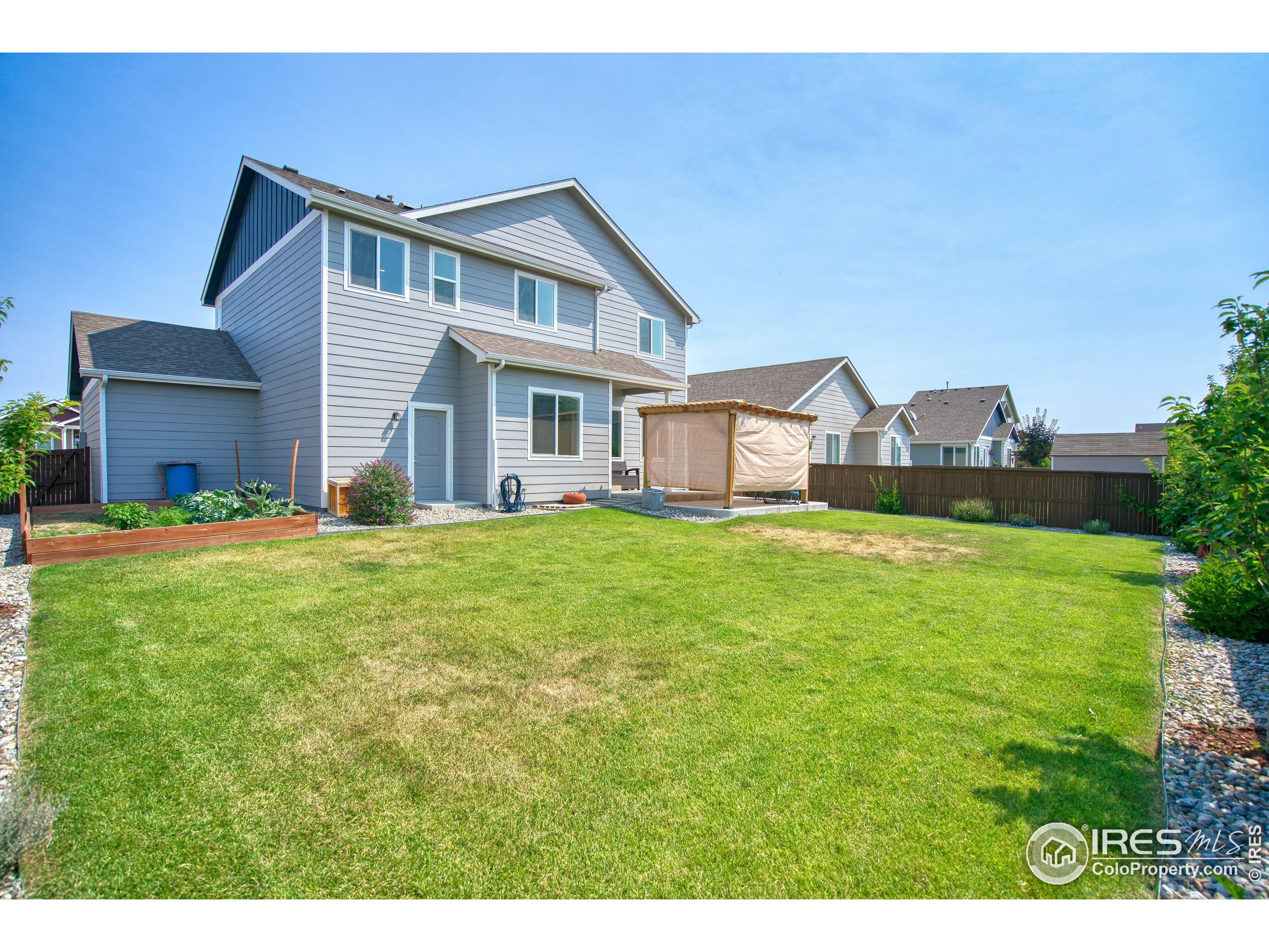 1866 Egnar Street Loveland, CO 80538 - Photo 12 of 28 a front view of a house with garden