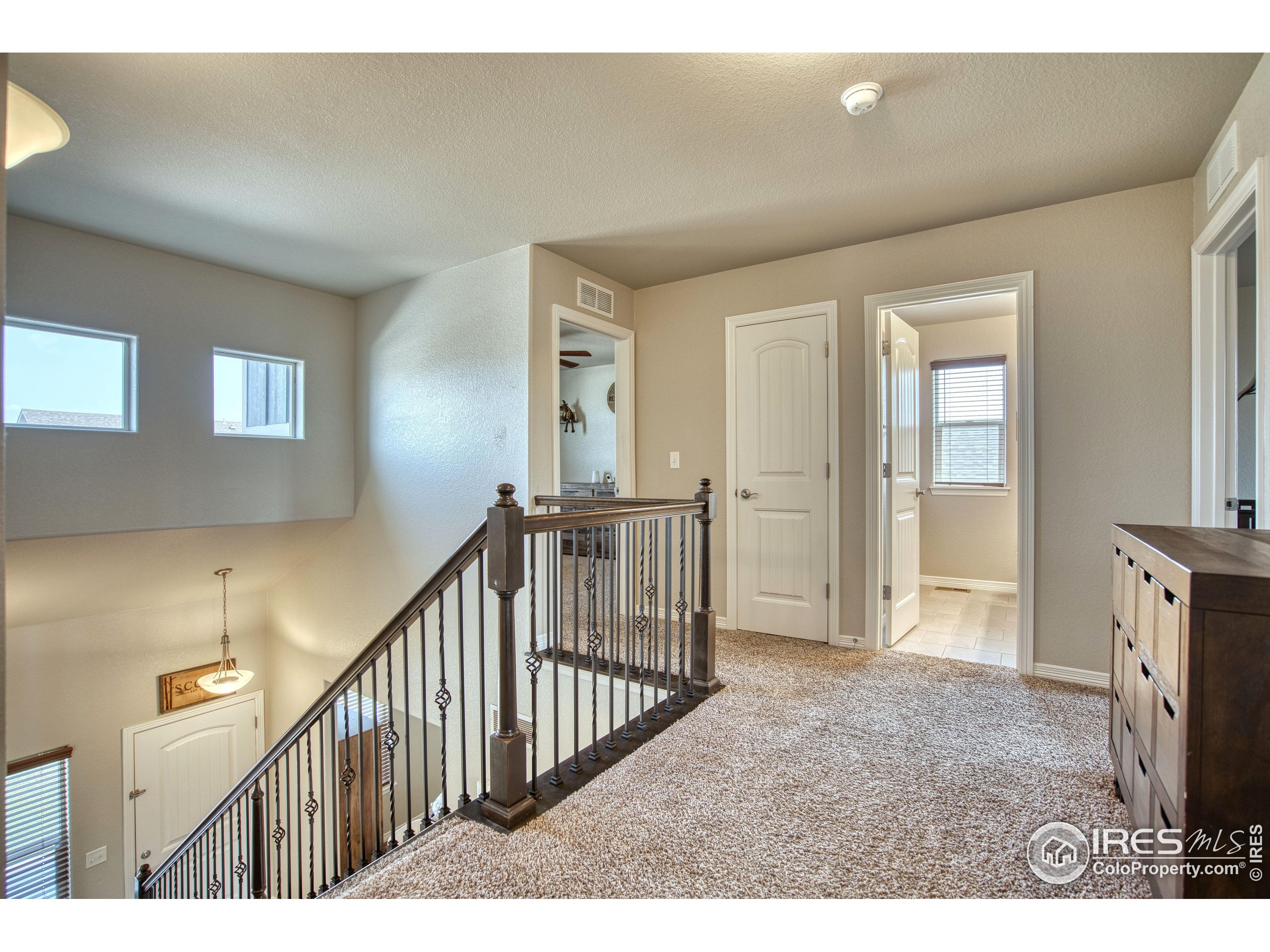 1866 Egnar Street Loveland, CO 80538 - Photo 13 of 28 a view of an entryway with wooden floor