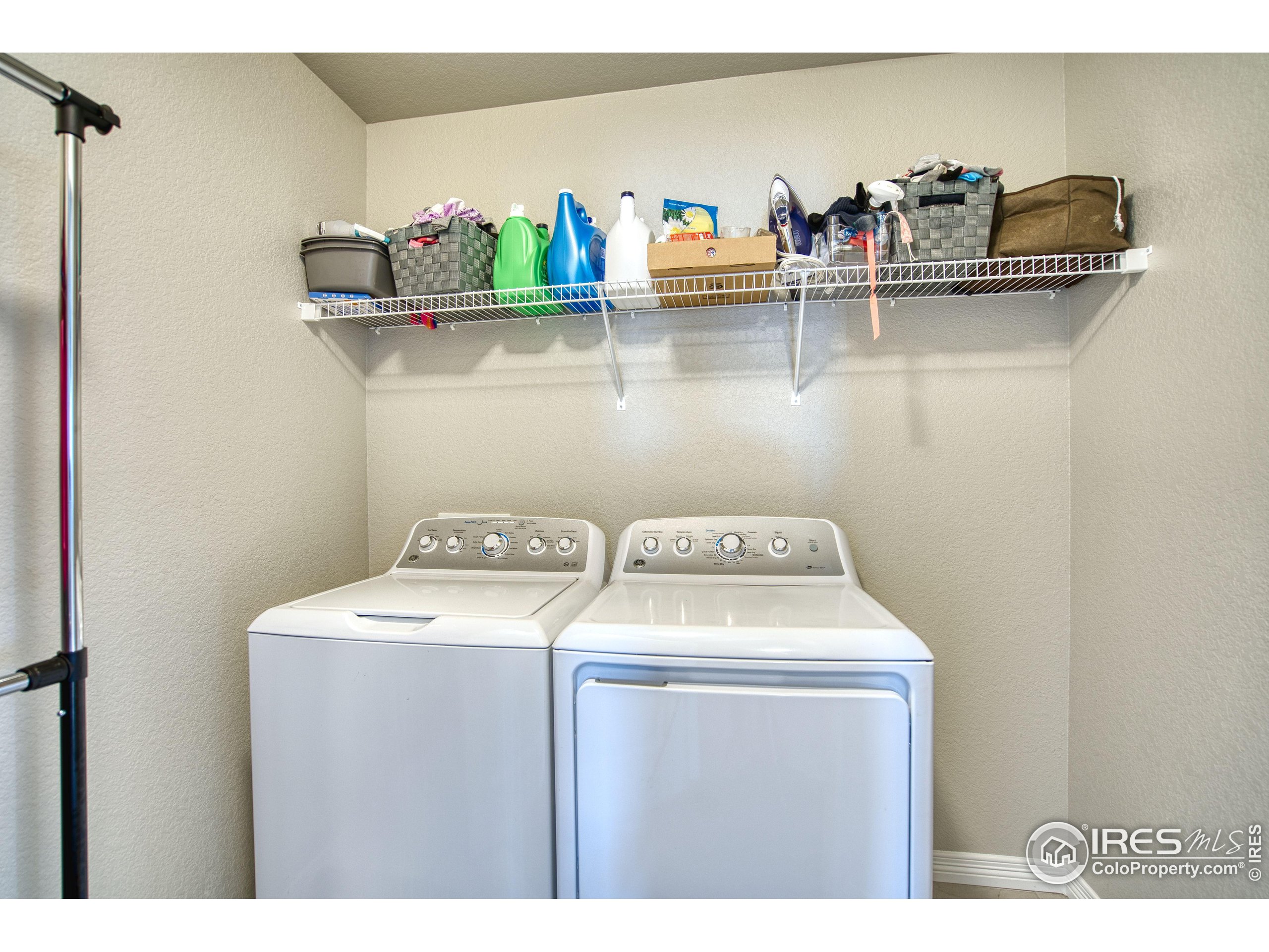 1866 Egnar Street Loveland, CO 80538 - Photo 22 of 28 a utility room with dryer and washer