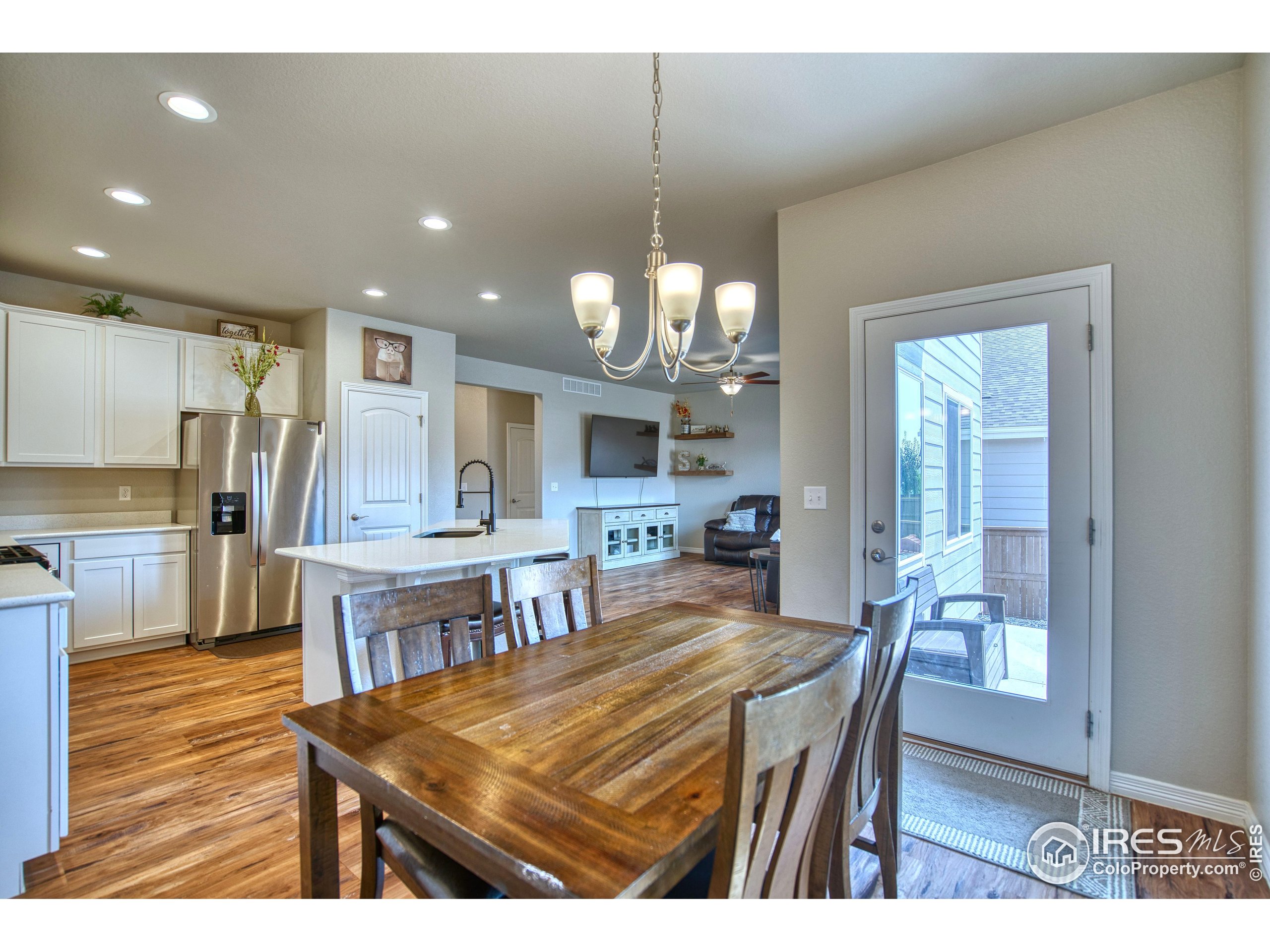 1866 Egnar Street Loveland, CO 80538 - Photo 7 of 28 a view of a dining room and livingroom view
