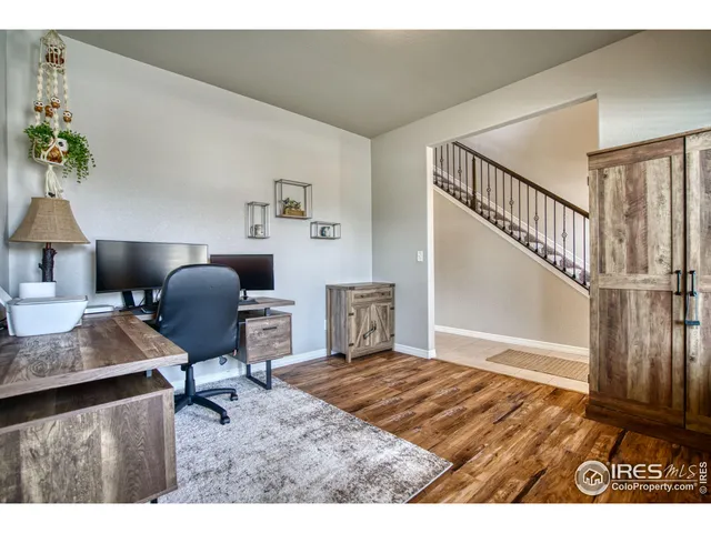 a workspace with furniture and a window