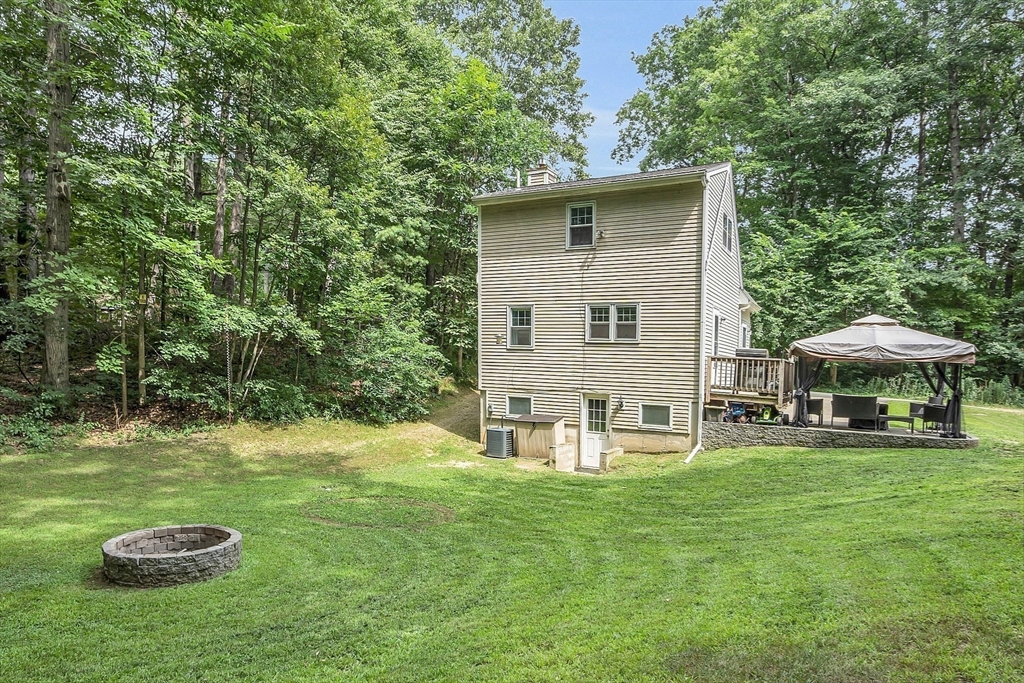 58 Indian Road Groton, MA 01450 - Photo 12 of 35 a view of a house with backyard
