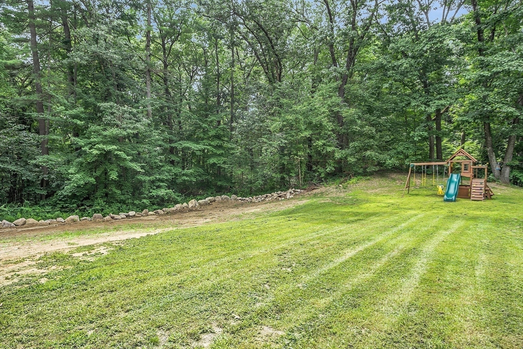 58 Indian Road Groton, MA 01450 - Photo 15 of 35 a view of outdoor space with deck and backyard