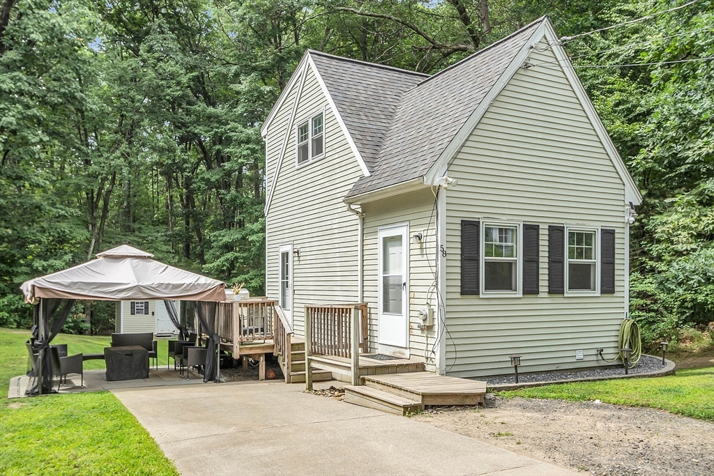 58 Indian Road Groton, MA 01450 - Photo 2 of 35 a view of a house with backyard