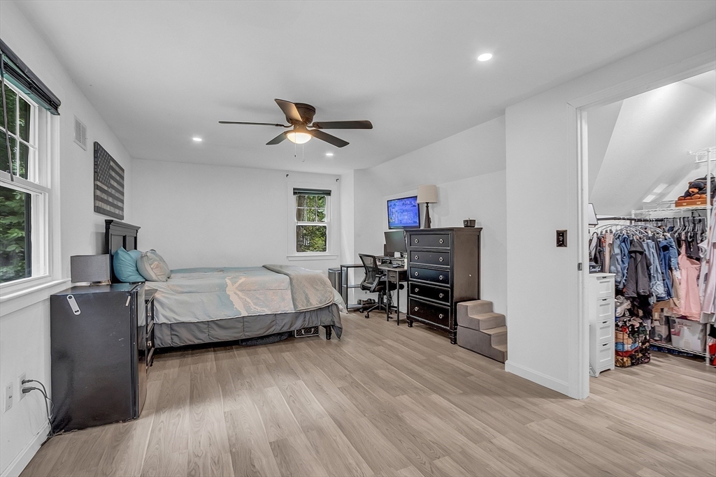 58 Indian Road Groton, MA 01450 - Photo 24 of 35 a bedroom with furniture and a wooden floor