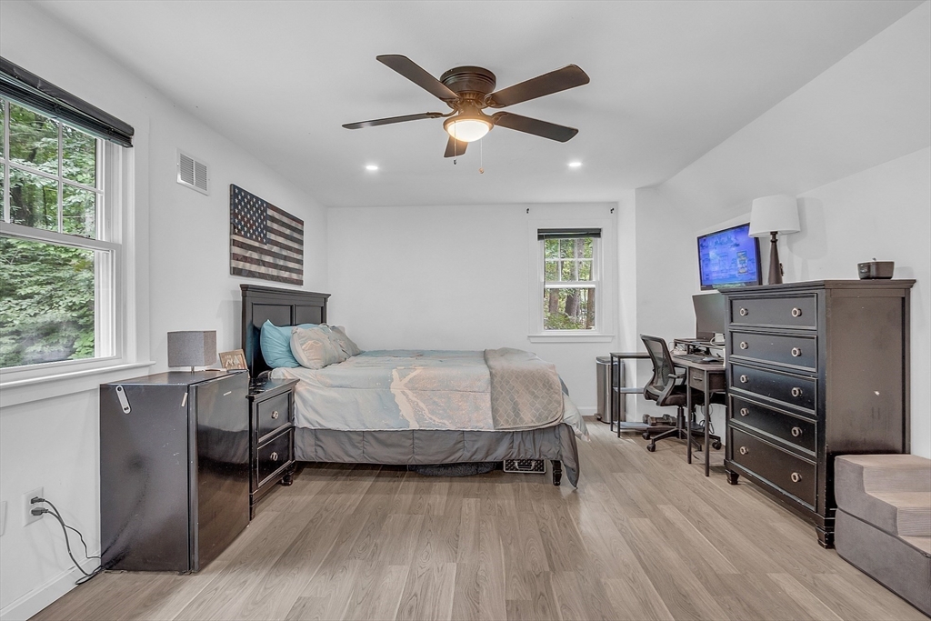 58 Indian Road Groton, MA 01450 - Photo 25 of 35 a bed room with a bed and a chair