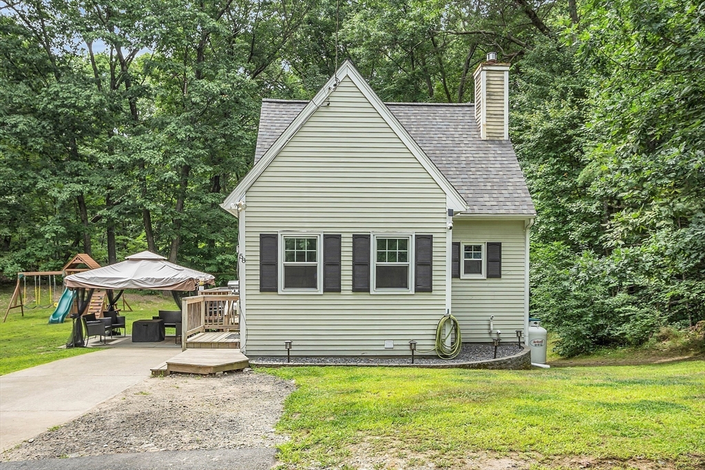 58 Indian Road Groton, MA 01450 - Photo 4 of 35 a view of a house with a yard