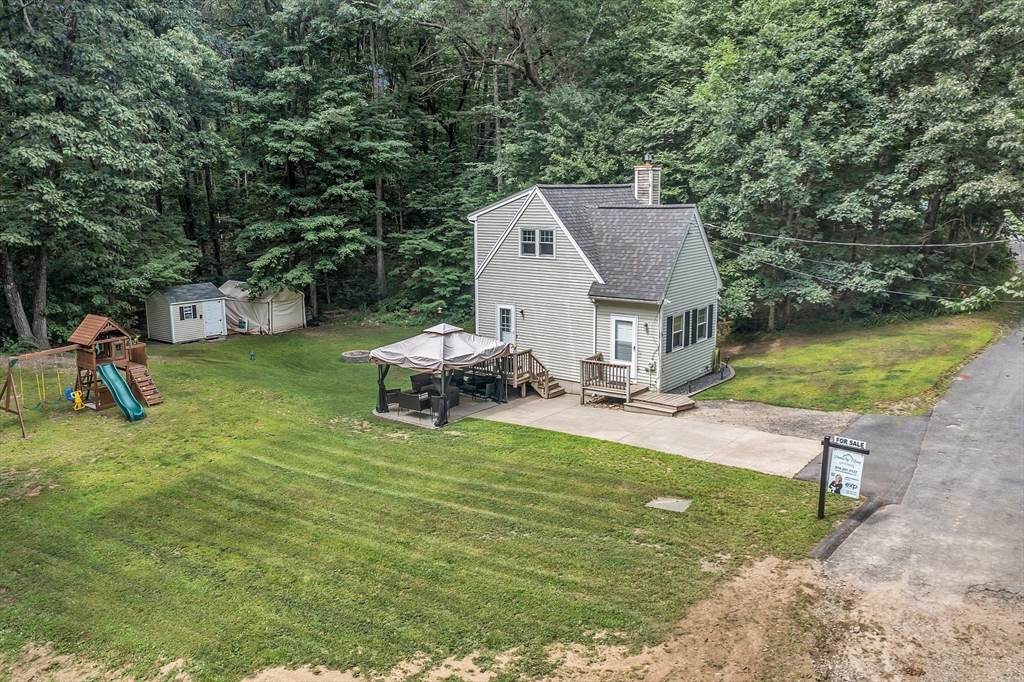 58 Indian Road Groton, MA 01450 - Photo 5 of 35 an aerial view of a house with swimming pool garden and patio