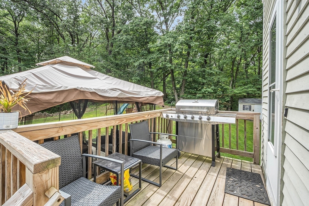 58 Indian Road Groton, MA 01450 - Photo 7 of 35 a view of a balcony with two chairs and a table