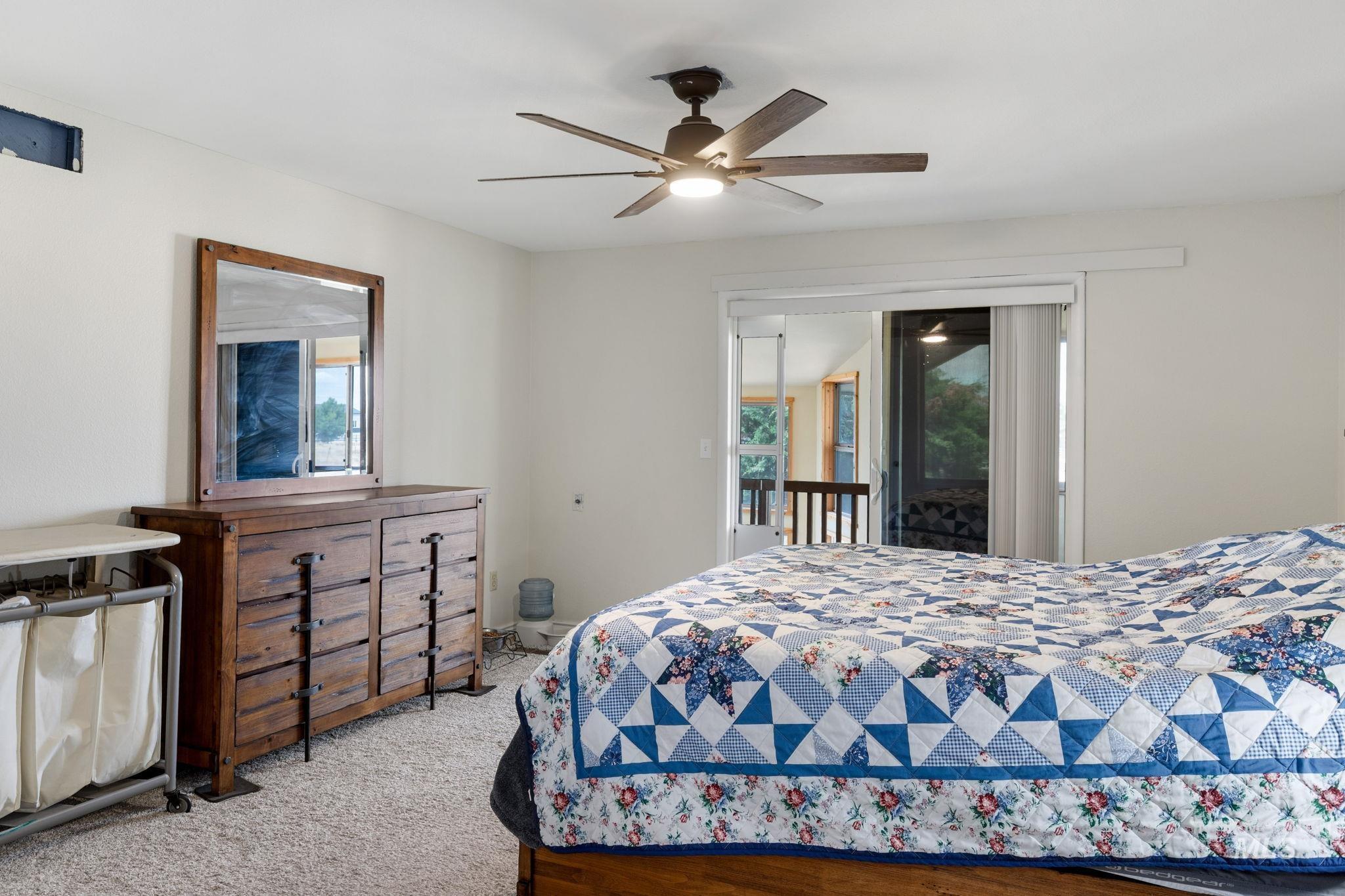 18338 Pride Lane Caldwell, ID 83607 - Photo 23 of 50 Neutral wall finishes with a ceiling fan light fixture